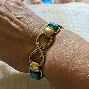 Infinity antique gold tone bracelet with beautiful turquoise strap adjustable